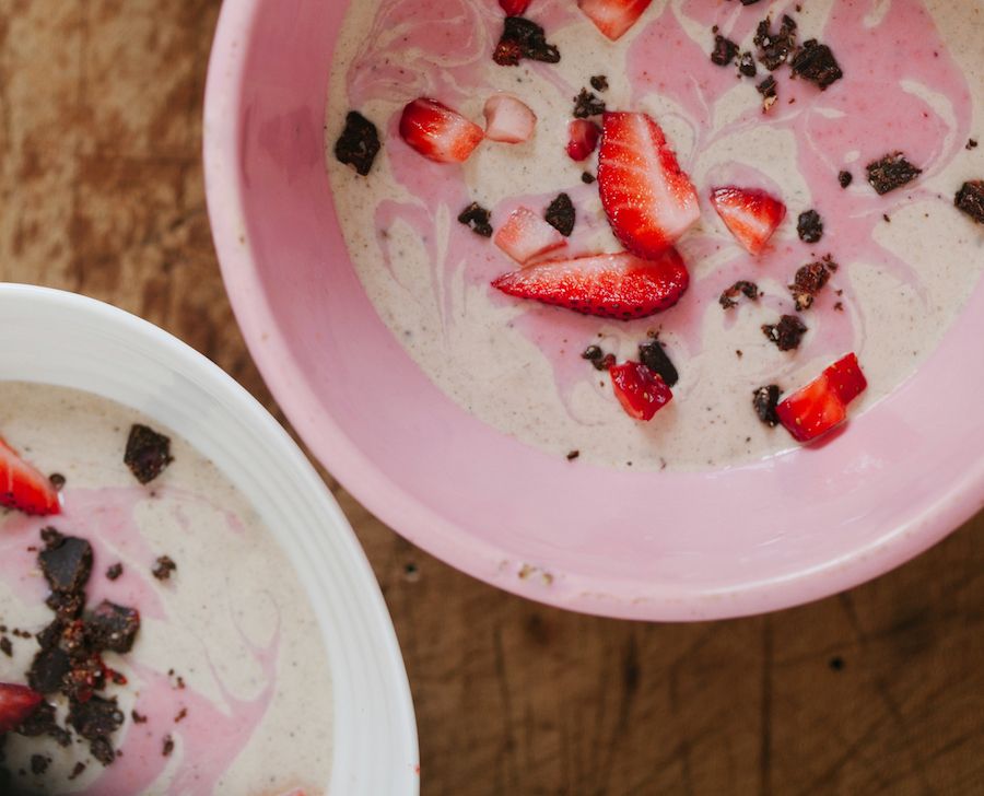 Breakfast bowl smoothie with fresh fruit like strawberry in it as a hangover cure