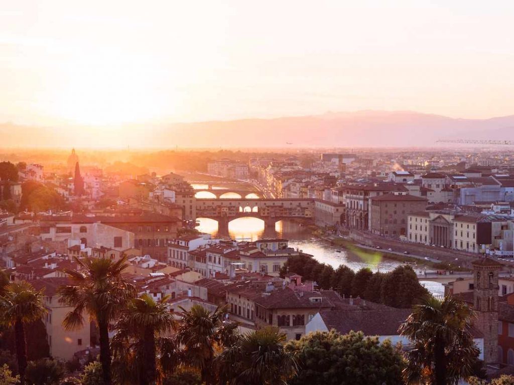 aerial view of a sunset over a fiery coloured city