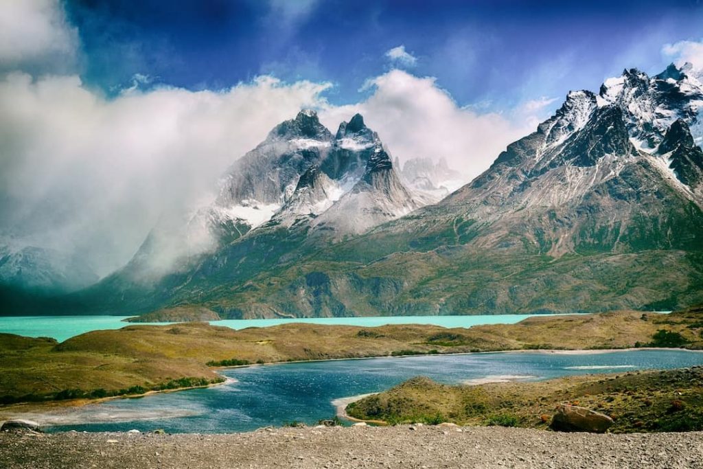 Mountain peaks surround a majestic turquoise lake in Chile 