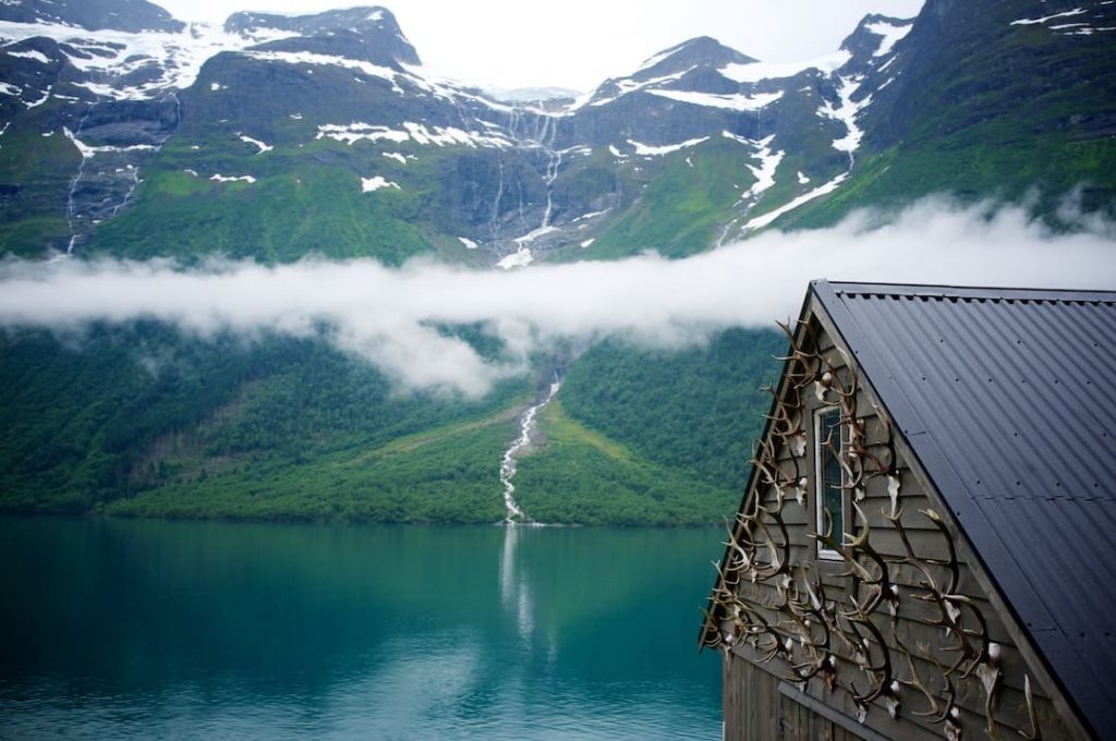 Mist cuts across a beautiful fjord in Norway 