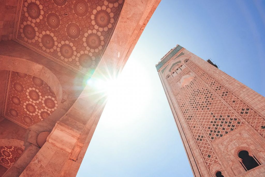 The tower of Hassan II Mosque featuring stunning Moroccan artisanship and design