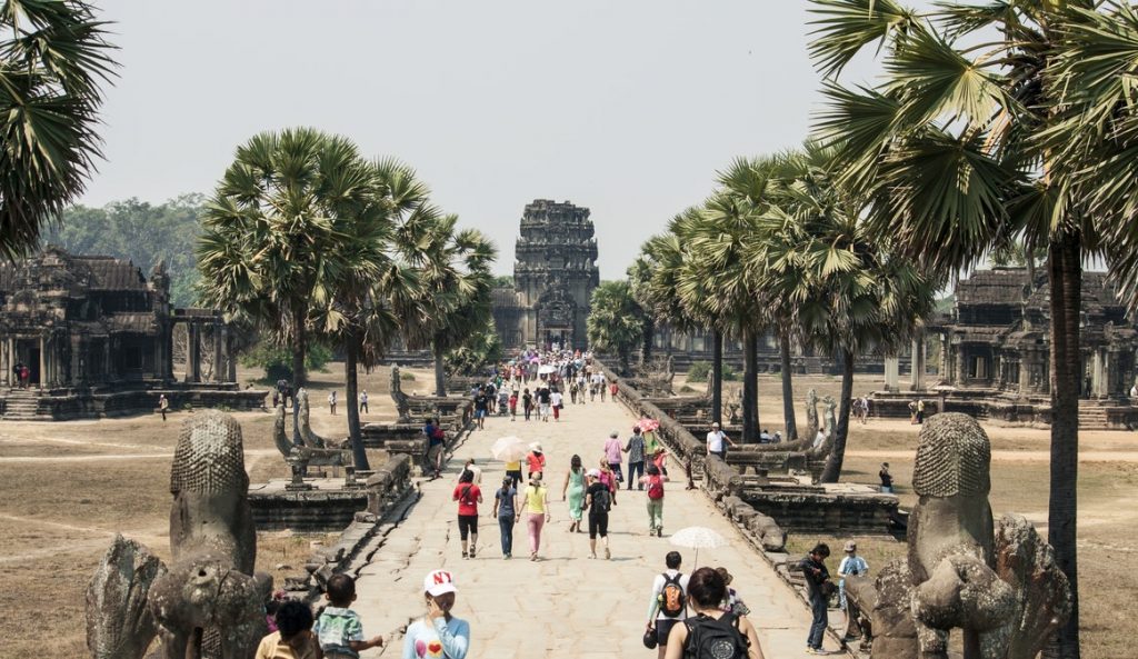 People taking a grand tour of a temple