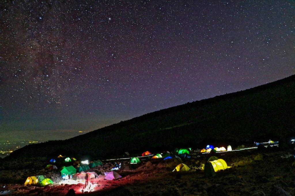 Colourful tents under the night sky on Kilimanjaro, Tanzania