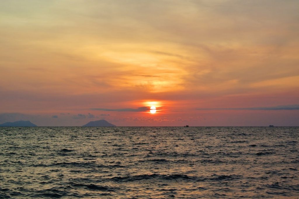 The sun setting over the ocean in Koh Tonsay, Cambodia