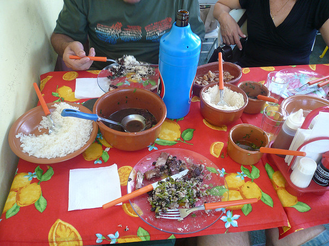 People sharing Feijoada in Brazil 