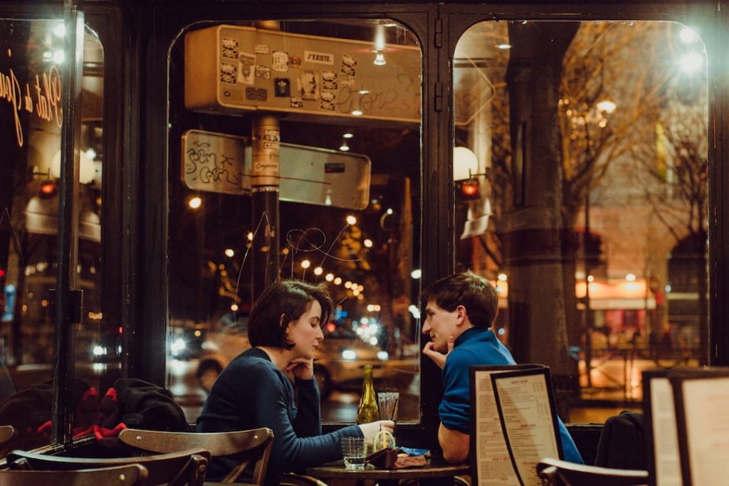 A couple in a bistro in Paris, France