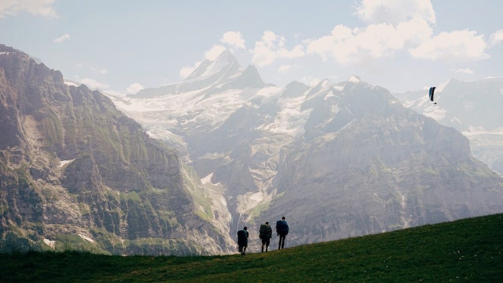 Three people walking in Switzerland