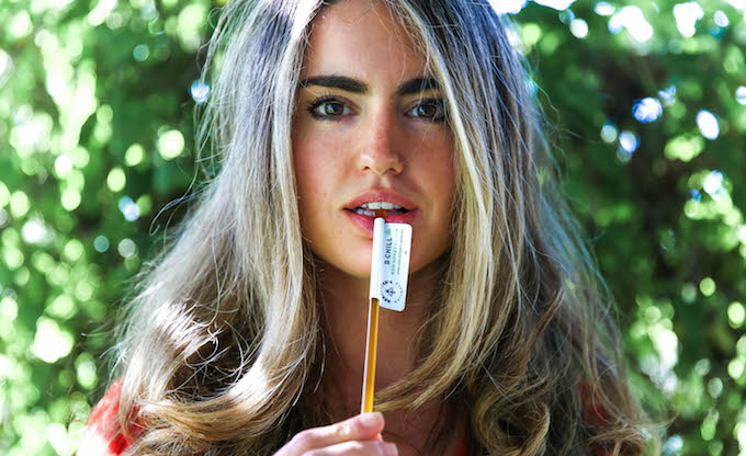 Carly Stein, founder of Beekeeper's Naturals holds one of her favourite products B.Chill Honey Sticks between her hands