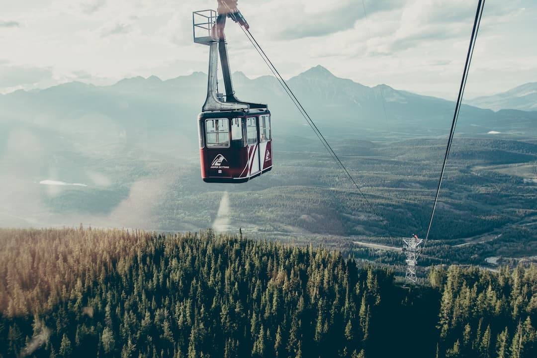 A red gondola against the mountains in Jasper National Park, Alberta