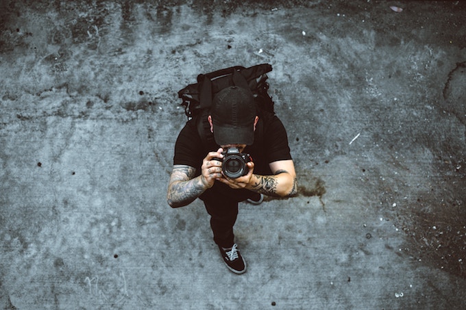 An arial shot of a man taking a photo