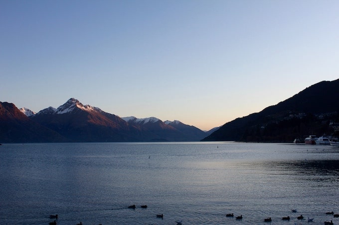 A lake surrounded by mountains in Queenstown, New Zealand