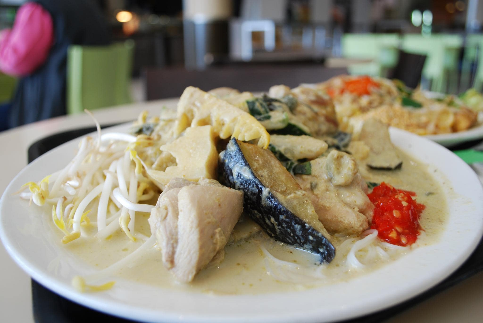 a heap of coloured vegetables in a coconut curry