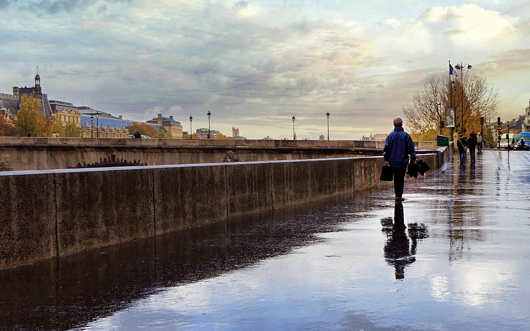 man walking beside the street