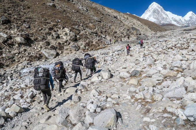 Hikers trekkig through Khumbu Icefall, Nepal