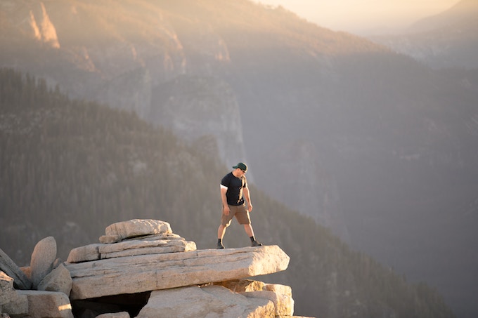 A man standing on top of Half Dome, Yosemite