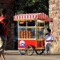 Vendor selling simit from a red push-cart in Istanbul, Turkey