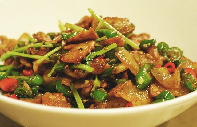 pieces of diced pork with green peppers and onions