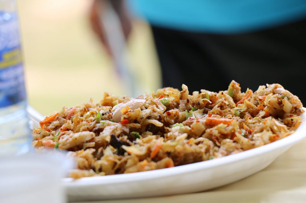 a plate of shredded thin flat breads with spices and meat