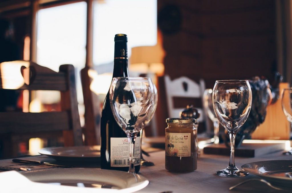 Table setting with a wine bottle and two wine glasses