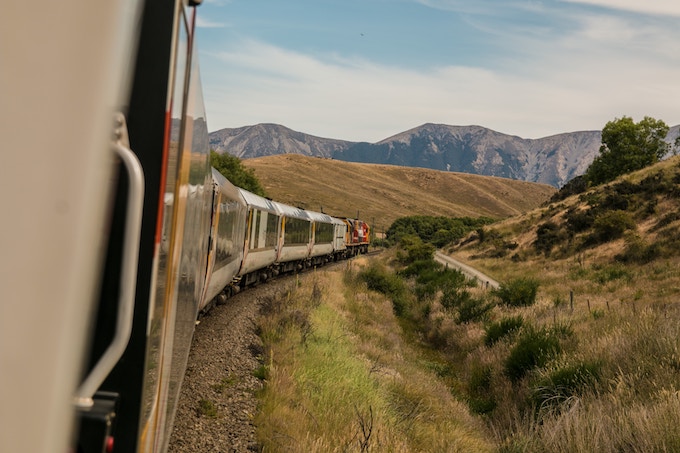 A train driving through the mountains in Canada