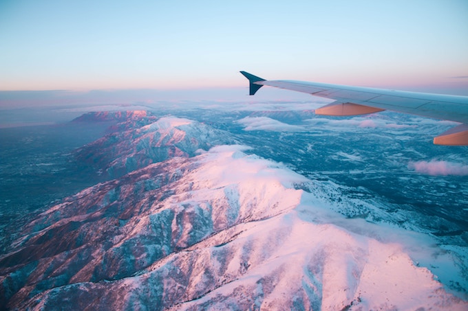 A plane flying over mountains