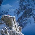 A man sitting on the top of a mountain in France