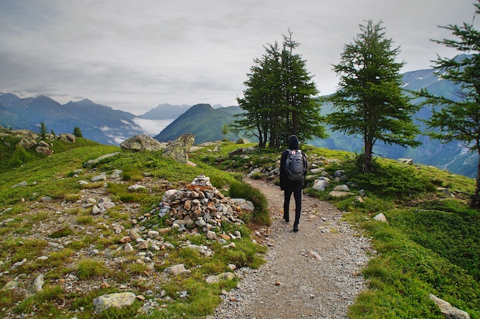 A man hiking on a trail in Lac Blanc, Chamonix, France