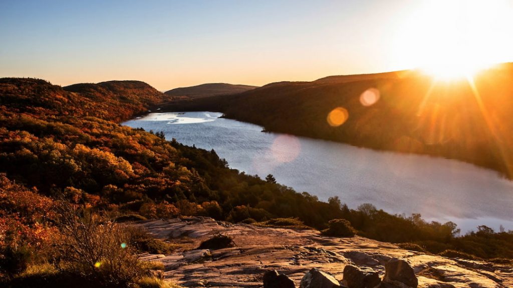 Sunrise over a river and hills in the Porcupine Mountains, Michigan