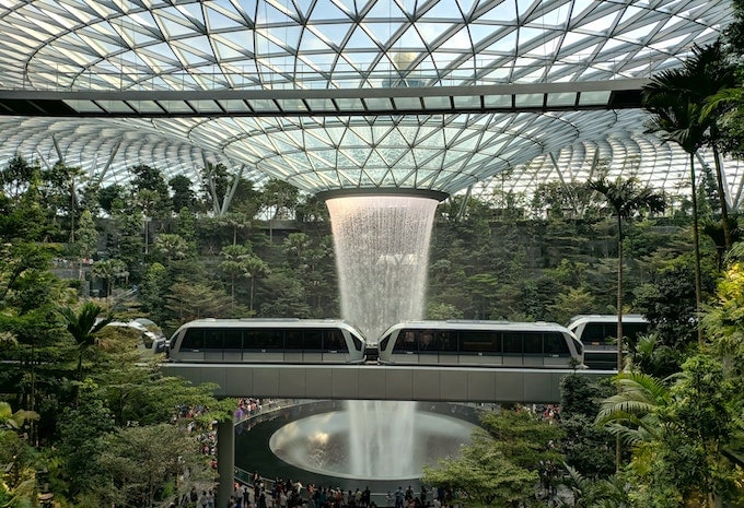 A monorail going through the water vortex in Changi Airport, Singapore