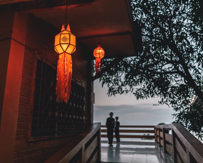 Two people standing on a balcony overlooking a valley in Chiang Mai, Thailand