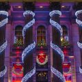 Lights wrapped around pillars of a building in Edinburgh, Scotland