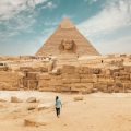 A man walking towards a Pyramid in Egypt