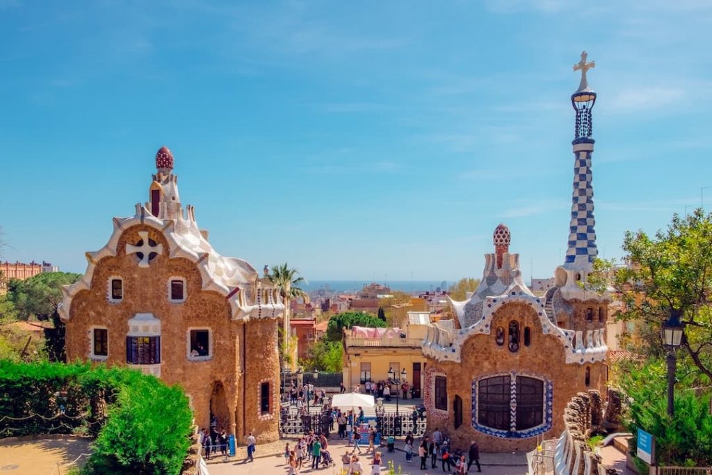 Tourists and Gaudi architecture at Park Guell in Barcelona, Spain