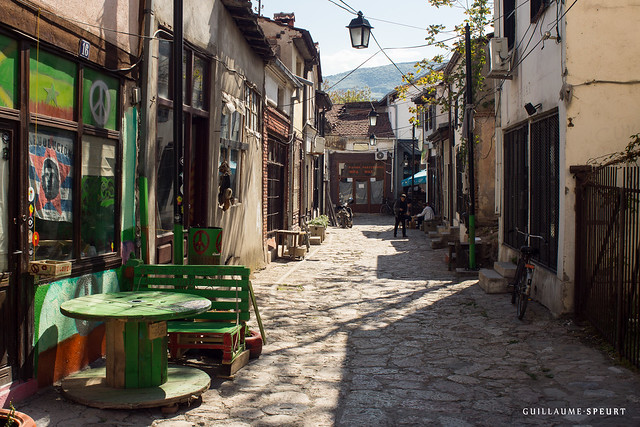 a narrow cobbled path through an alleyway 