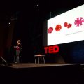 Margaret Wertheim on stage speaking at TED in 2009