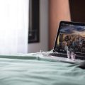 Laptop sitting on table with New York City screensaver