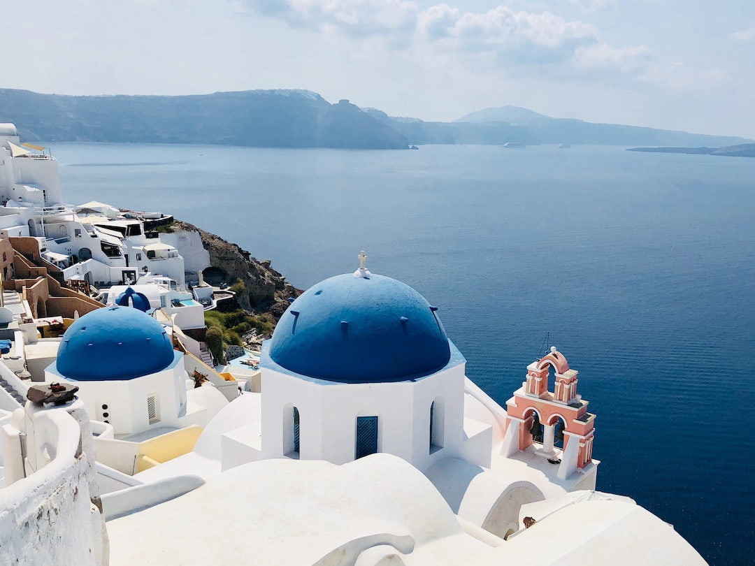 White washed and blue domed church in Santorini