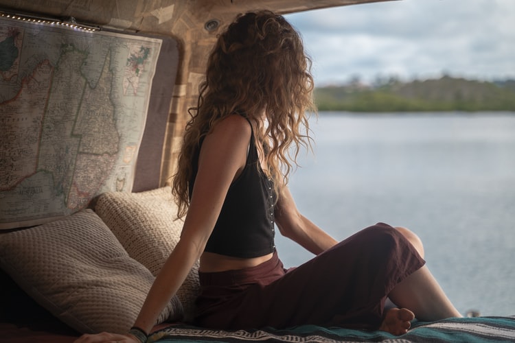 a girl looking out at the lake