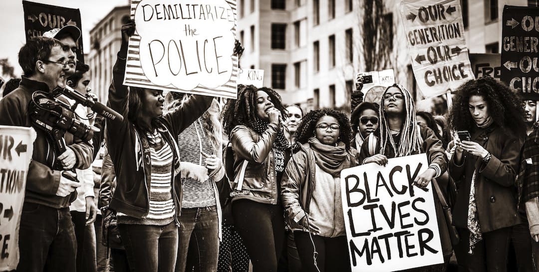 Group of people holding signs at Black Lives Matter protest