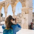 Woman taking a picture of ruins