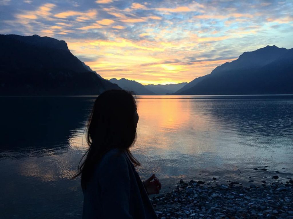 Woman standing near lake in Brienz, Switzerland