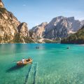 little boats sailing along a lake