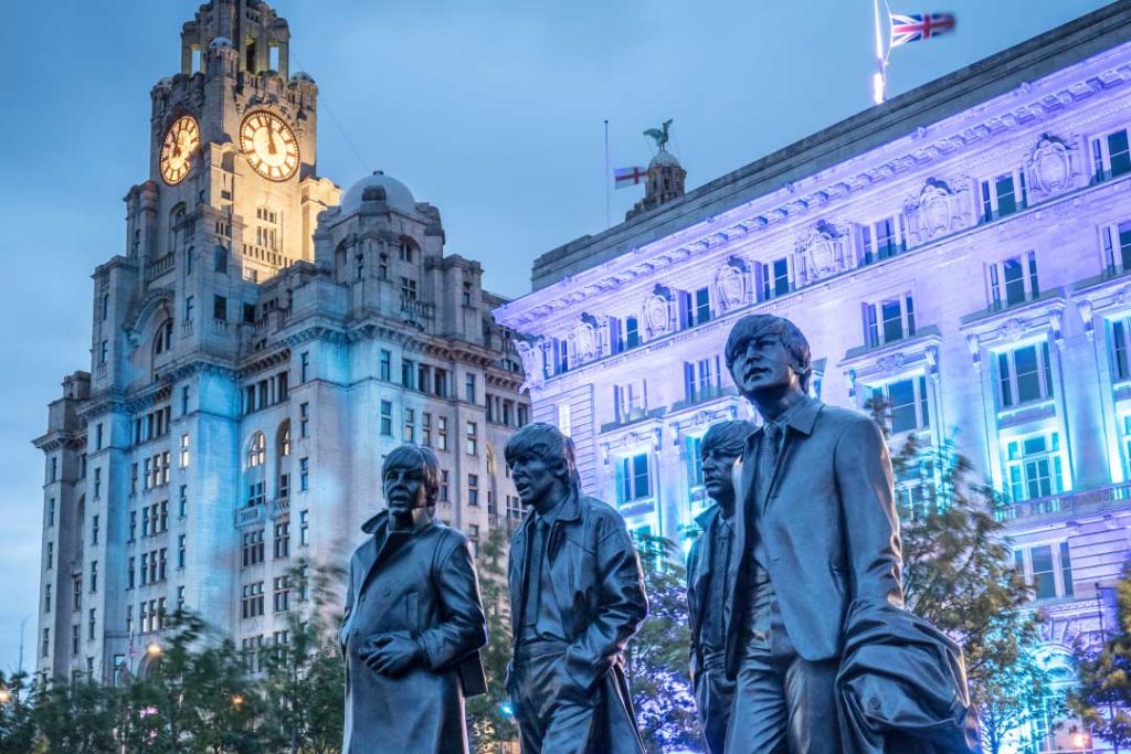 Beatles sculpture and Three Graces, Liverpool, Merseyside, England.