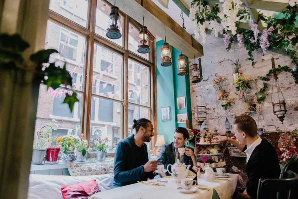 A group of men enjoying afternoon tea in the Richmond Tearooms, Manchester.